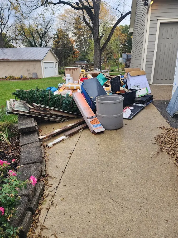 Dumpster being loaded with debris for 3 Yard Dumpster Rental in Cochran